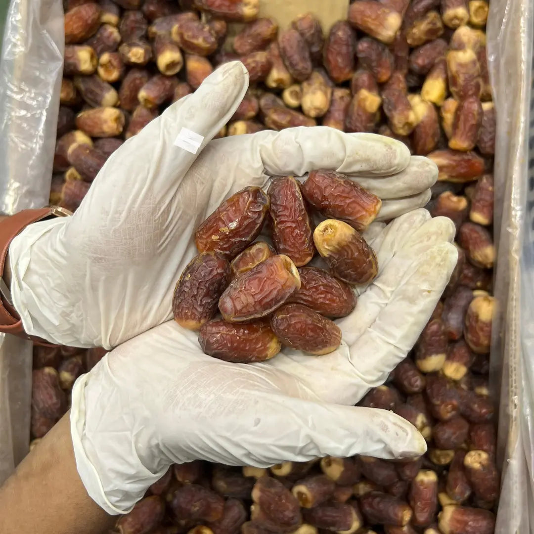 Close up of imported Sughai dates in Pakistan by Al Madni Traders.